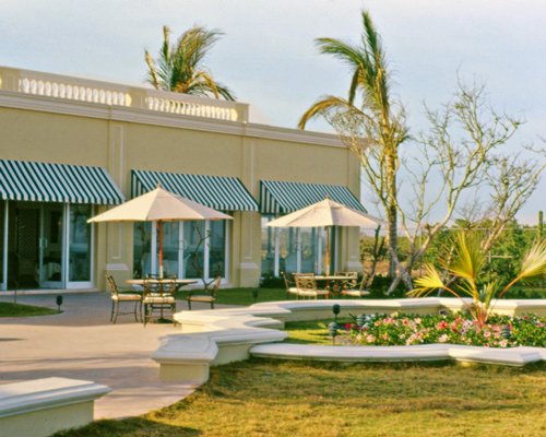 Scenic exterior view of resort units with an outdoor dining area.