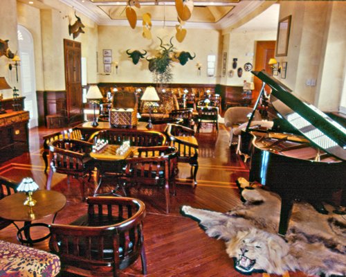 A well furnished indoor restaurant with a piano.