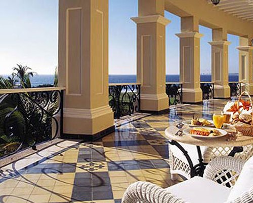 Outdoor patio with a waterfront view.