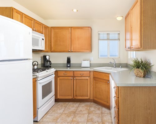 A well equipped kitchen with a microwave.