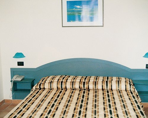 A well furnished bedroom with a double bed.