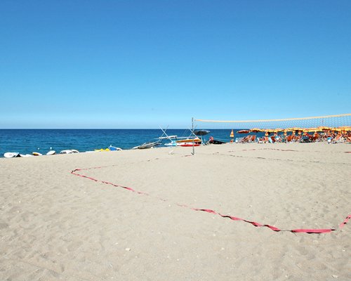 A view of beach volleyball court alongside the beach.