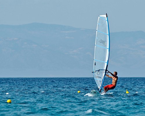 A man windsurfing.