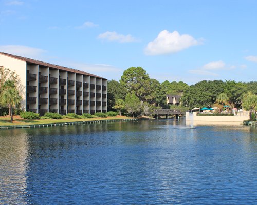 An exterior view of the Island Club IV resort with the waterfront.