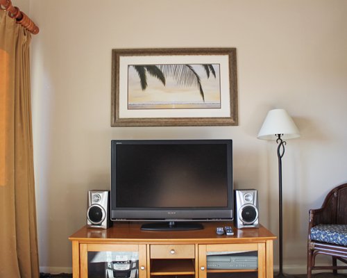 A flat screen television and speakers.