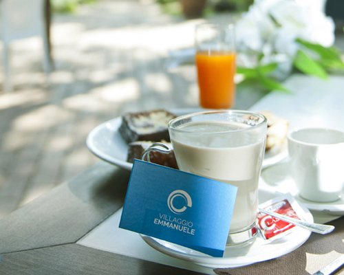A view of food fresh juice and milk on a table.