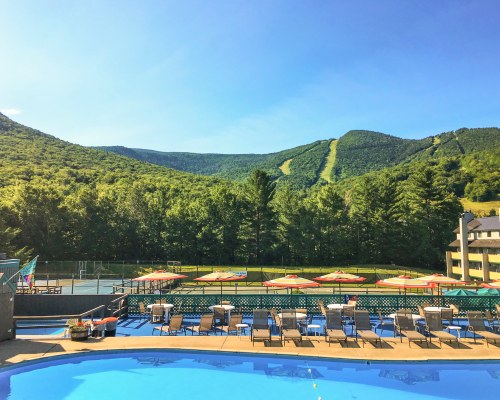 OUTDOOR SWIMMING POOL ALONGSIDE OUTDOOR RECREATION AT THE RESORT.