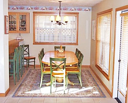 Dining area with an open plan kitchen and breakfast bar.