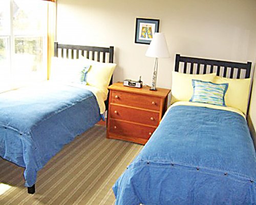 A well furnished bedroom with two beds.