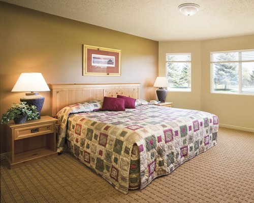 A well furnished bedroom with an outside view.