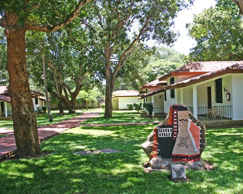 Scenic exterior view of Mwembe Resort with a pathway.