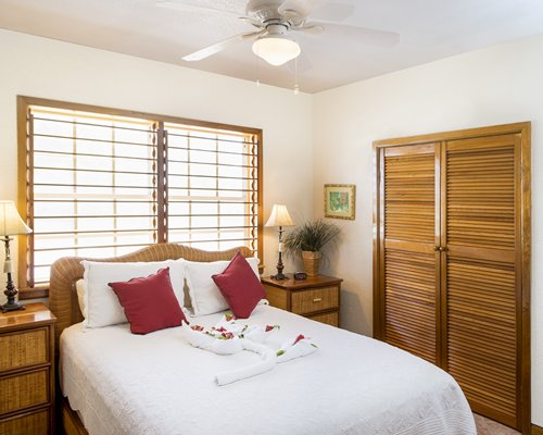 A well furnished bedroom with an outside view.