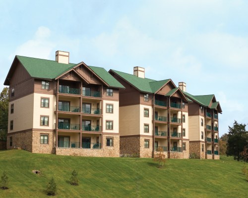 SCENIC EXTERIOR VIEW OF A MULTI STORY RESORT UNIT WITH INDIVIDUAL BALCONIES.