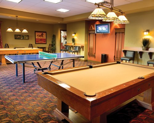 An outdoor recreational pool table and table tennis.