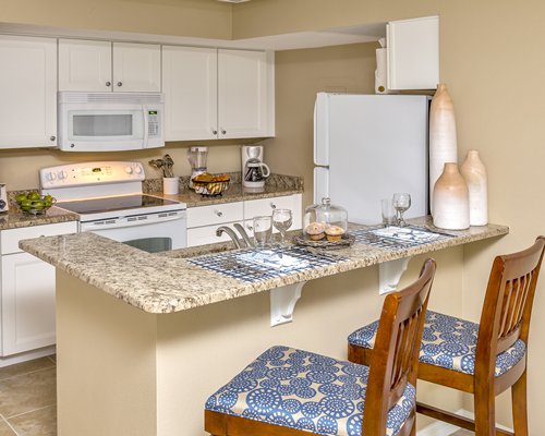 The Furnished kitchen with high chairs at Exploria Resort