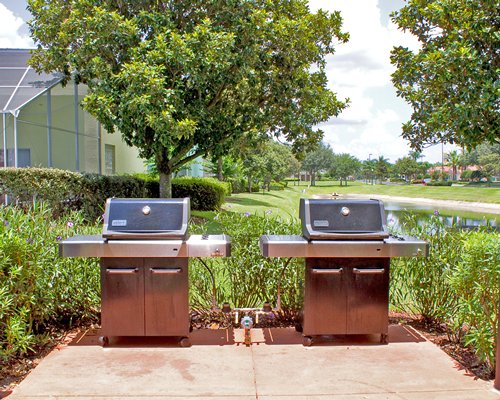 Outdoor picnic area with barbecue grills.