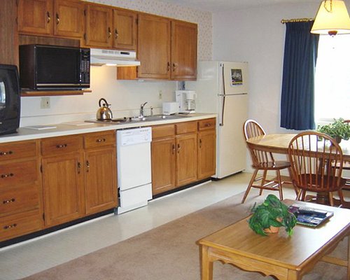 An open plan dining and kitchen with a microwave oven.
