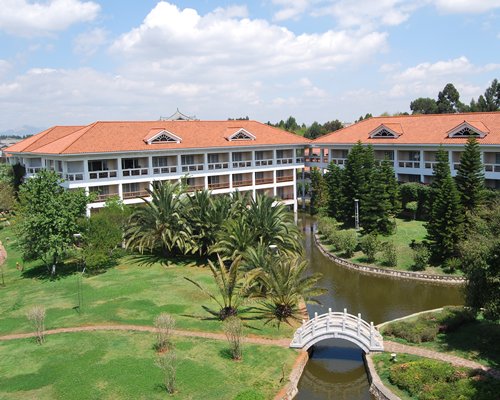 Scenic view of Dianchi Garden Hotel & Spa with a bridge.
