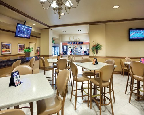 An indoor fine dining area with television.
