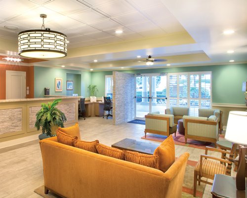 A well furnished reception area of the resort with lounge access.