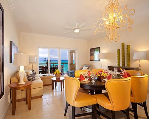 An open plan dining and living with balcony.