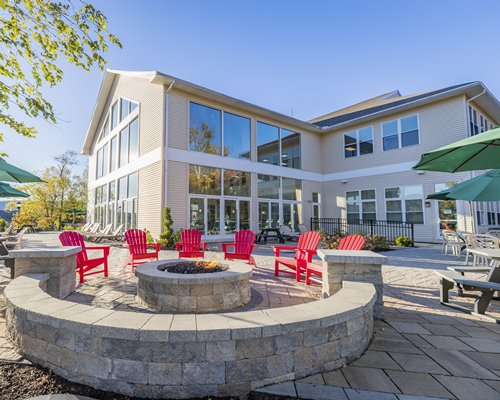 Outdoor swimming pool with chaise lounge chairs.