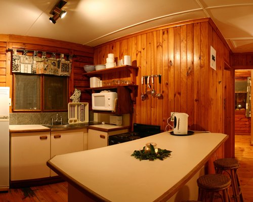 An open plan kitchen with breakfast bar.