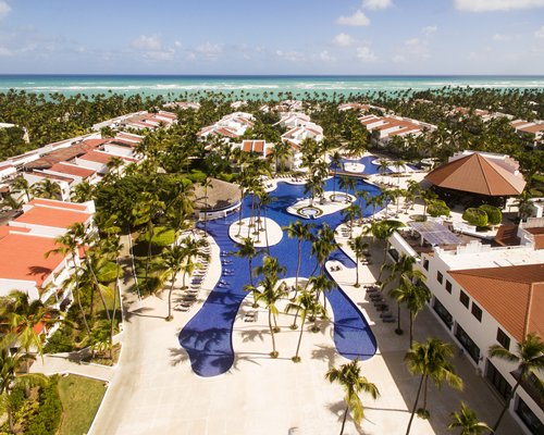 An aerial view of the resort with pool and ocean.