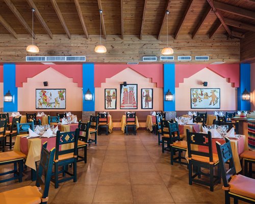 A restaurant interior with multiple dining tables.