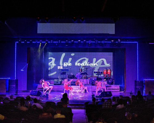 View of people performing on stage at an entertainment show.