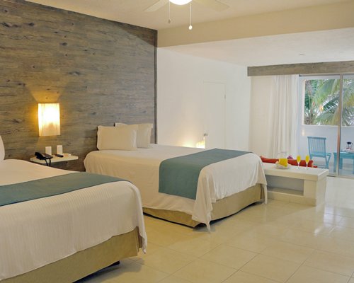 A well furnished bedroom with vanity.