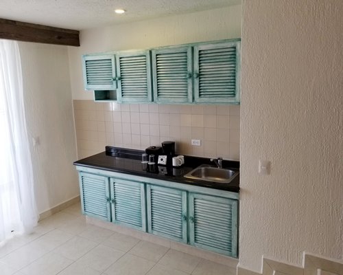 A well furnished bedroom with two beds.
