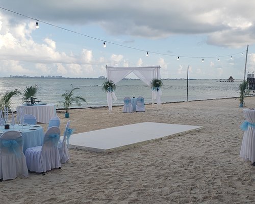 A well furnished fine dining restaurant with an outside view.