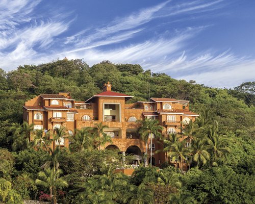 Scenic exterior view of WorldMark Zihuatenejo surrounded by wooded area.