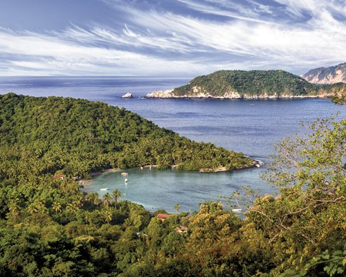 An aerial view of the ocean alongside the mountain.