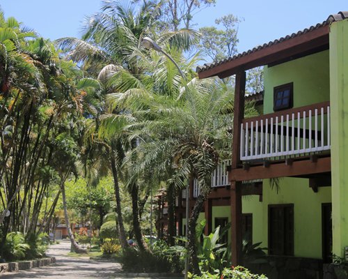 An exterior view of a resort unit surrounded by trees.