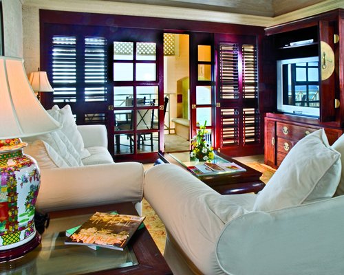 A well furnished living room with a television.