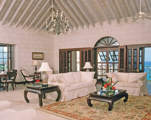 An open plan living and dining area with an ocean view.