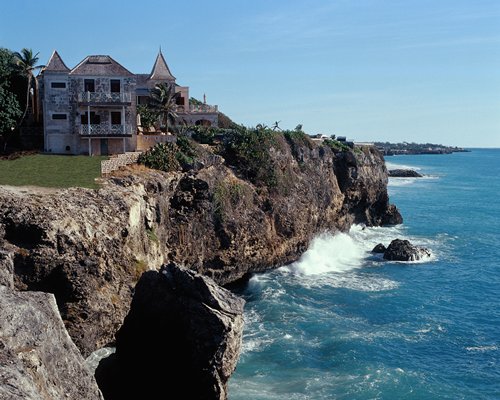 An exterior view of the Crane Residential Resort alongside the ocean.