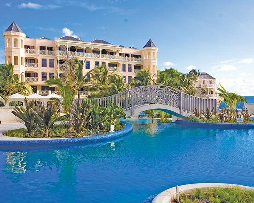 A scenic view of the Crane Residential Resort alongside a swimming pool.