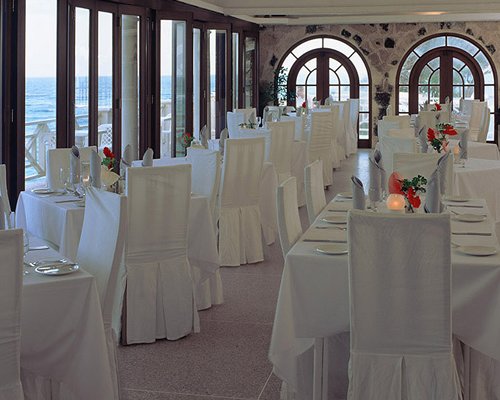 A well equipped restaurant with multiple dining tables.