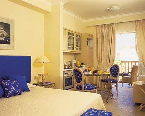 An open plan bedroom kitchen and dining area.