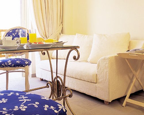 A well furnished living room and dining area.