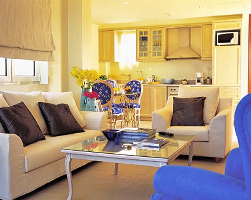 An open plan furnished living room and kitchen area.
