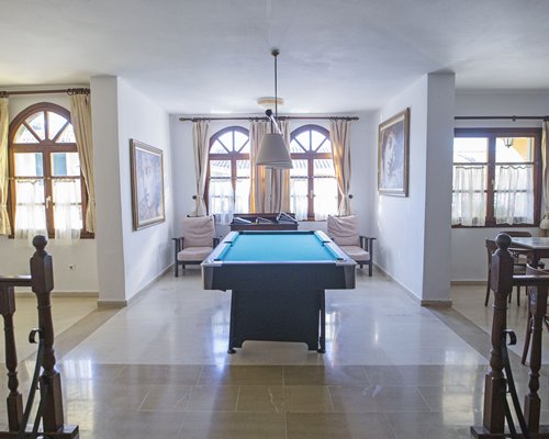 Indoor recreation area with pool table.