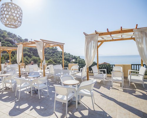 Outdoor restaurant with a view of the sea.