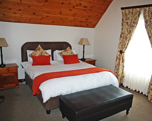 A well furnished bedroom with a double bed.