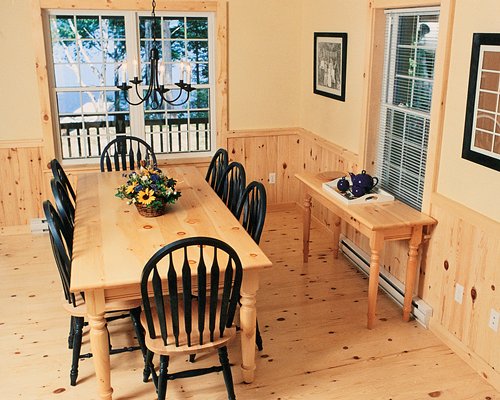 A well furnished dining room with an outside view.