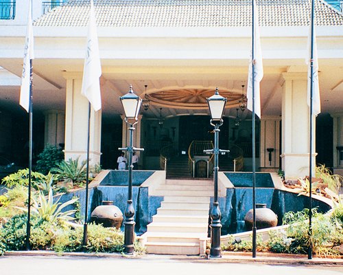 Entrance to Hilton Mumbai International Airport Hotel with four flags.