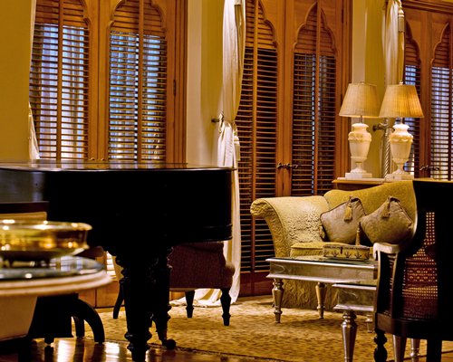 A well furnished living area with a piano.